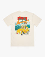 Cream t-shirt with a graphic of a yellow car and text on a mountain background