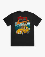 Black t-shirt with a graphic of a yellow car and text on a mountain background