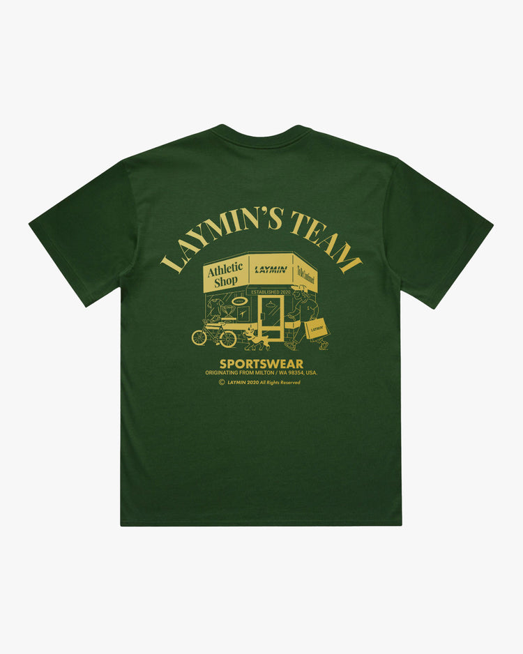 Green t-shirt with yellow graphic and text